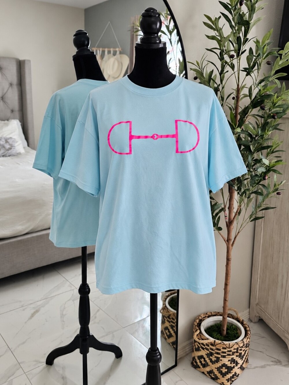 Light Blue Graphic Tee with Pink Bit Design